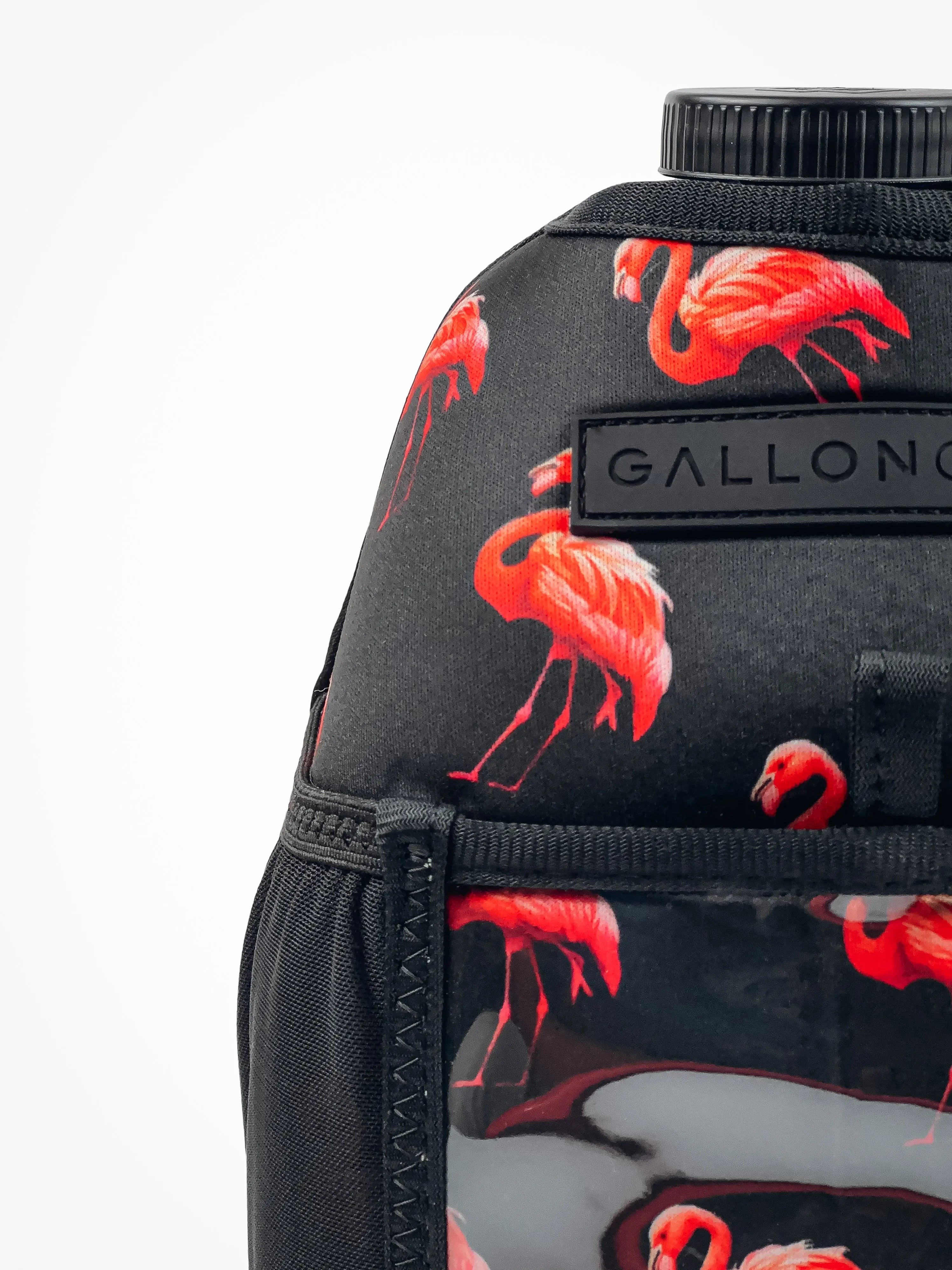 Black gym water bottle with vibrant pink flamingo print and 'GALLON' label, ideal for fitness hydration.