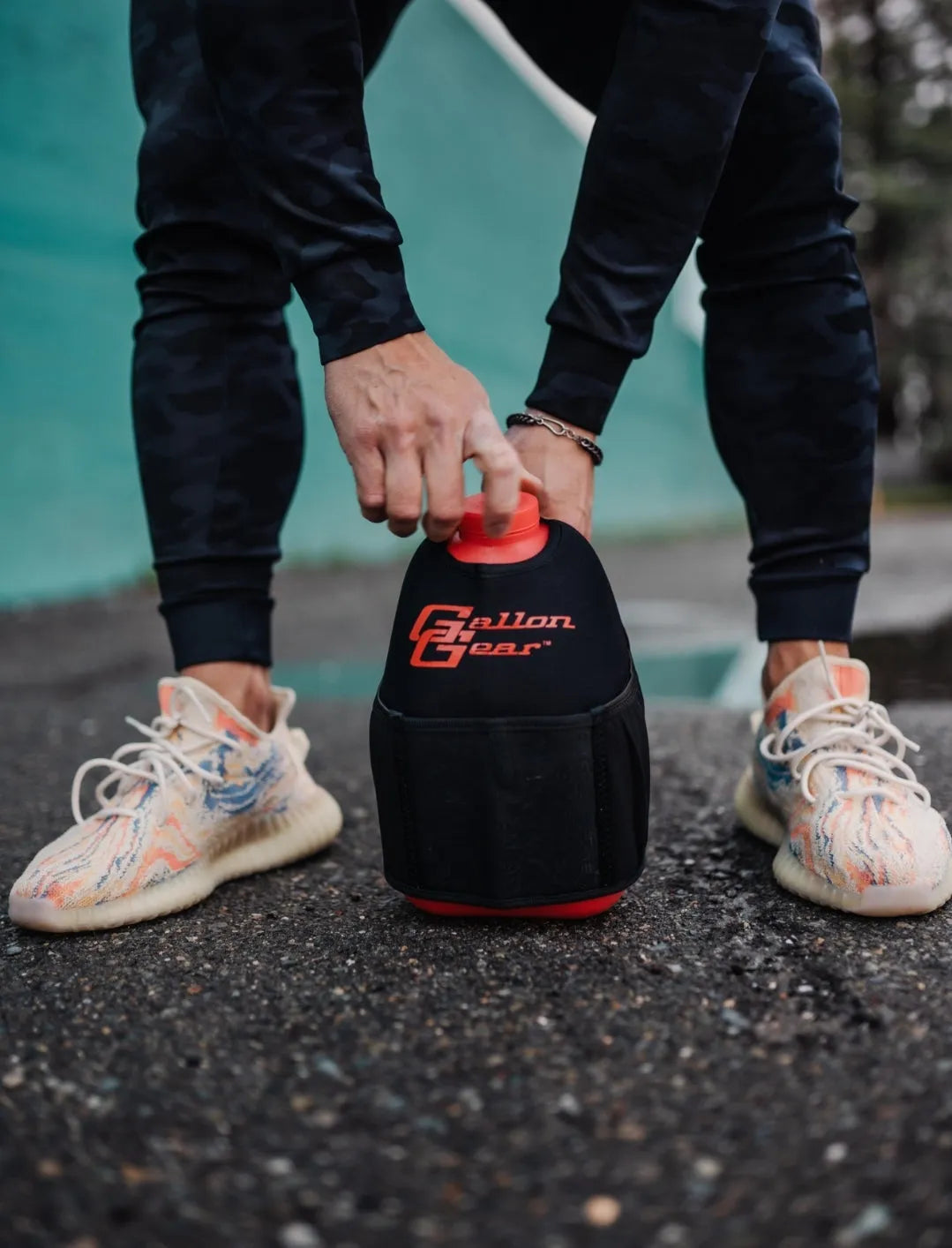 "2025" GALLON GEAR HALF GALLON BOOTY | GYM WATER BOTTLE SLEEVE (BLACK/RED)