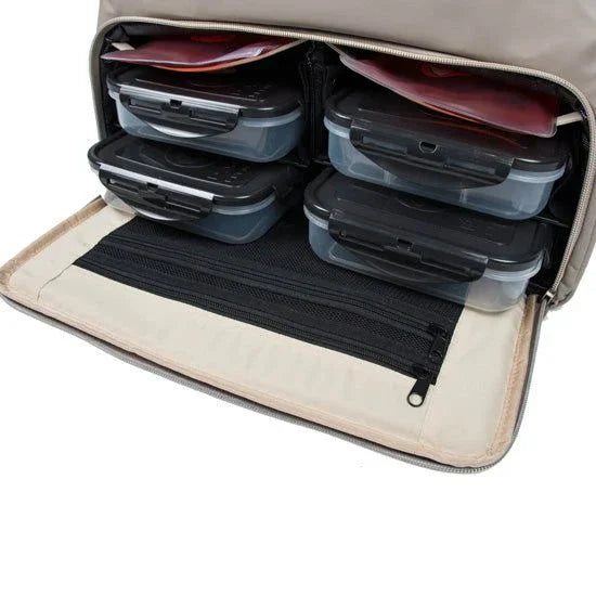 Meal prep containers neatly packed in insulated lunch bag for gym or work